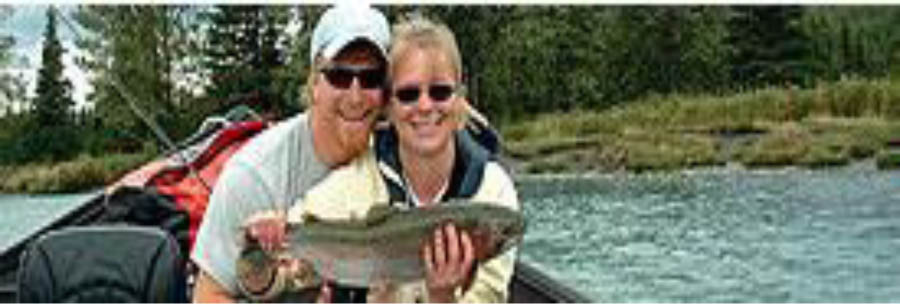 Women-holding-trout-with-tour-guide