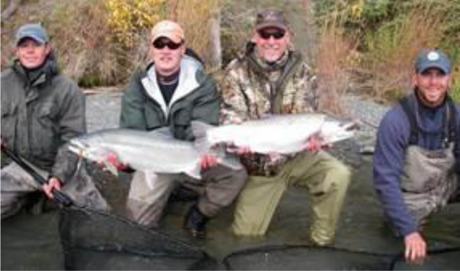 two-men-showing-trophy-fish two-men-showing-trophy-fish