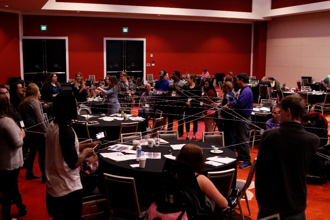 Group of people around a conference area