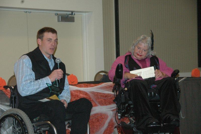 Linda gives award to Corey