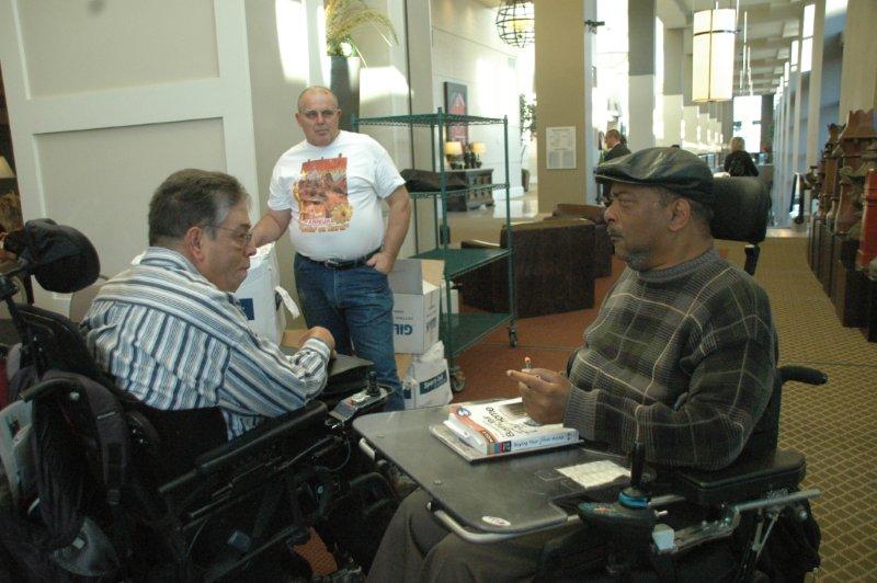 Two men in chairs having a discussion