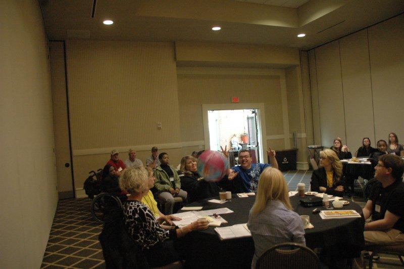 Workshop group with ball in the air