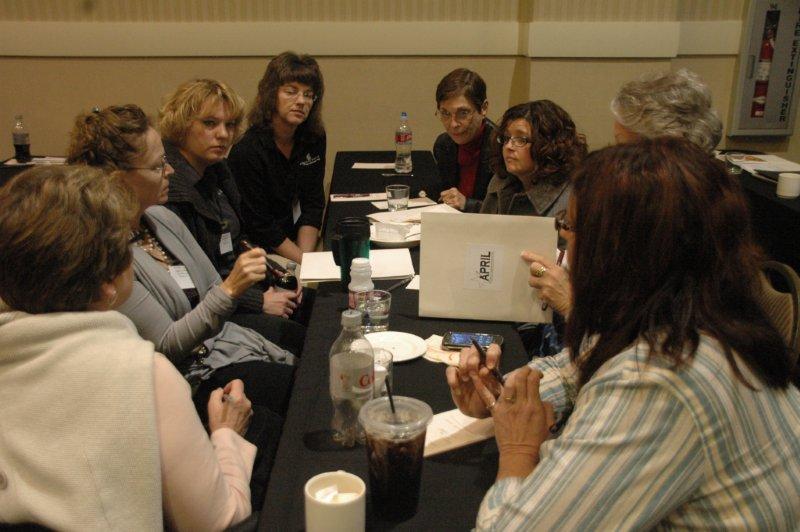 8 advocactes at a table