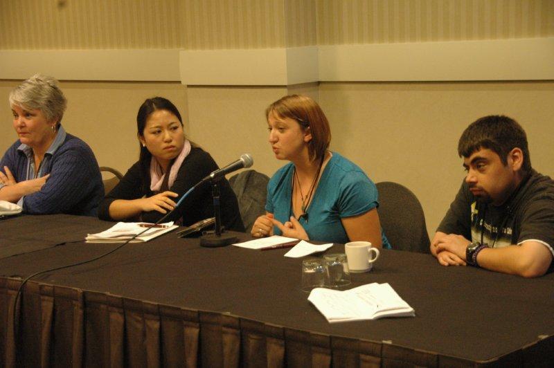 4 people at the front discussion table