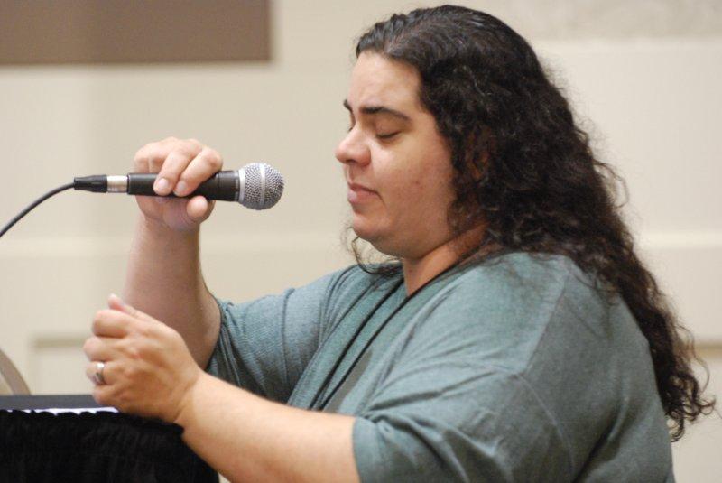 Lady adjusting microphone