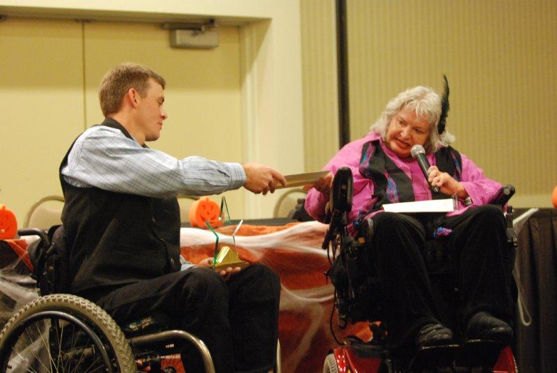 Man is accepting the award