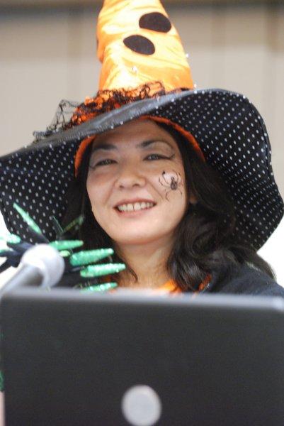 lady in witch costume with a spider