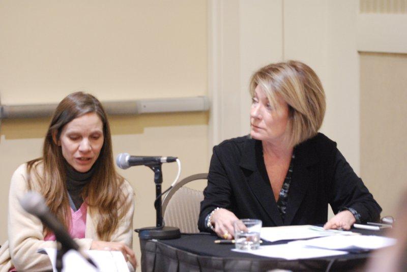 2 ladies listening to speaker