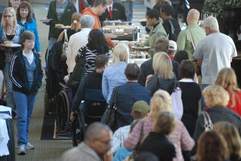 Large group photo form above as people are fixing food