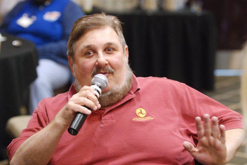 man speaking into a microphone